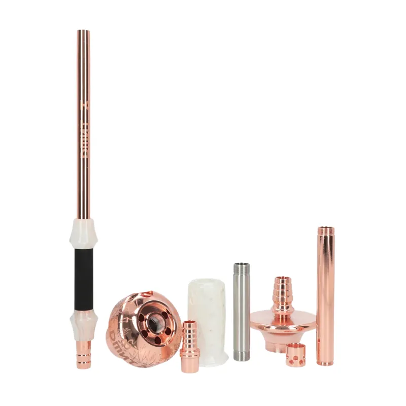 Cachimba DMNT Alkimia Premium Gold Rose Edition española en acero inoxidable de alta calidad con baño de oro rosa, grabados exclusivos, sistema de purga horizontal y maletín de transporte en The Good Shisha